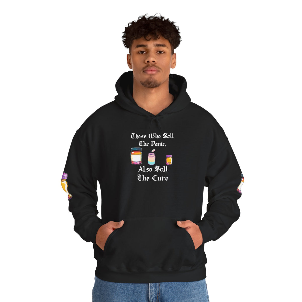Black hoodie with gothic blackletter text “Those Who Sell the Panic, Also Sell the Cure” and three colorful pill bottles